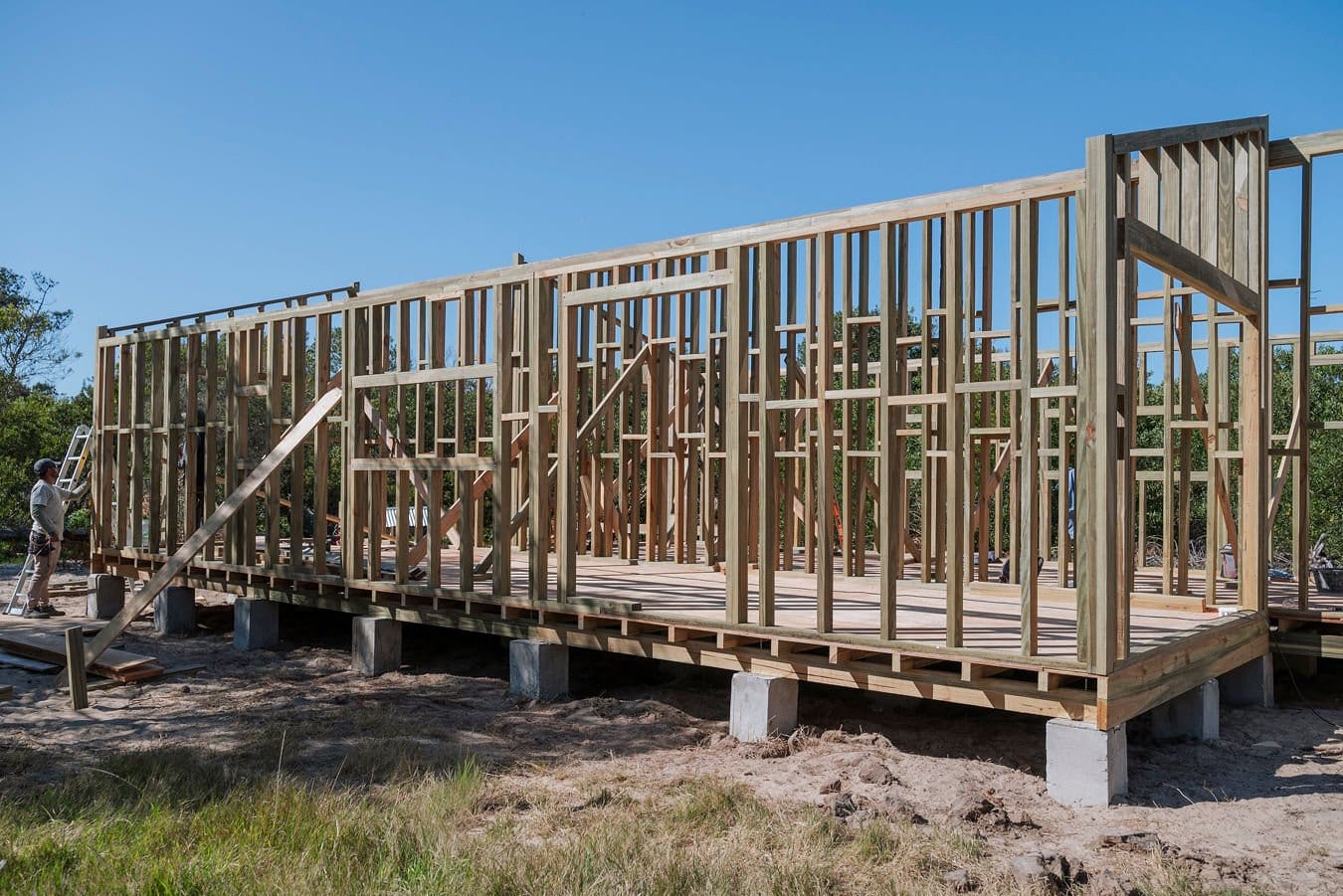 Timber frame of Casas Las Serenas on concrete piers